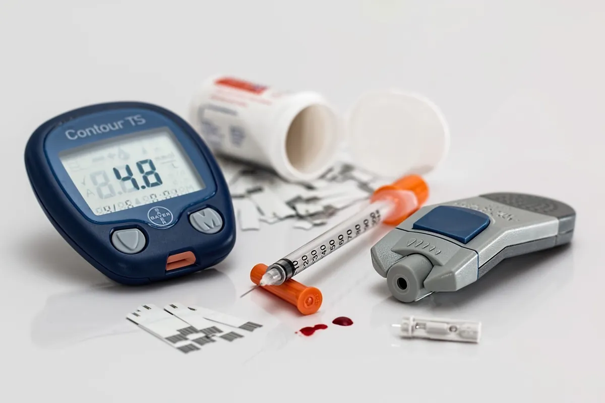Blood glucose meter, test strips, lancing device and insulin syringe